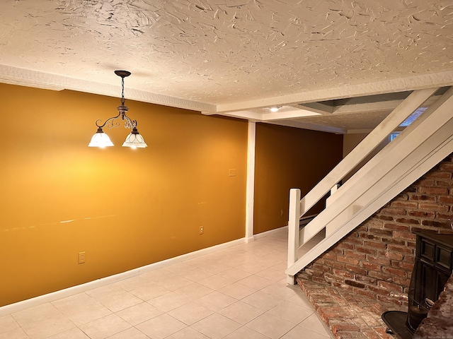 basement with tile patterned floors and a textured ceiling