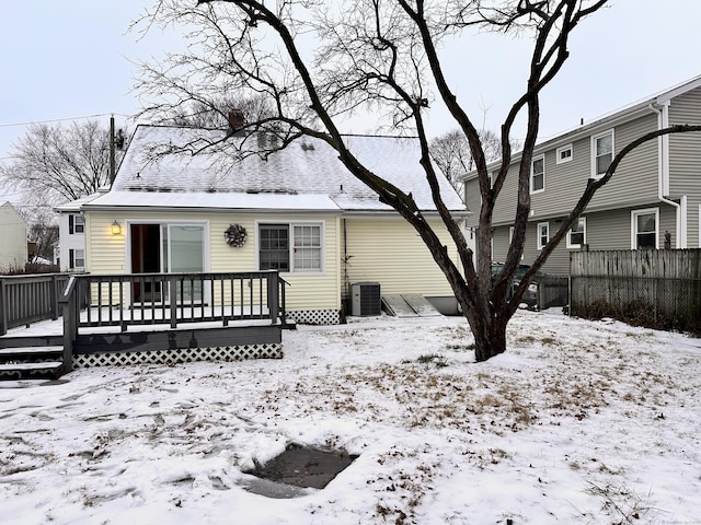 view of front facade with cooling unit and a deck