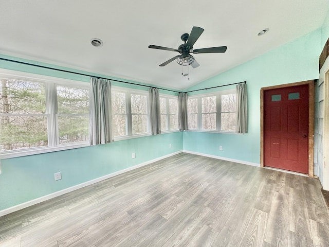 interior space featuring ceiling fan and vaulted ceiling