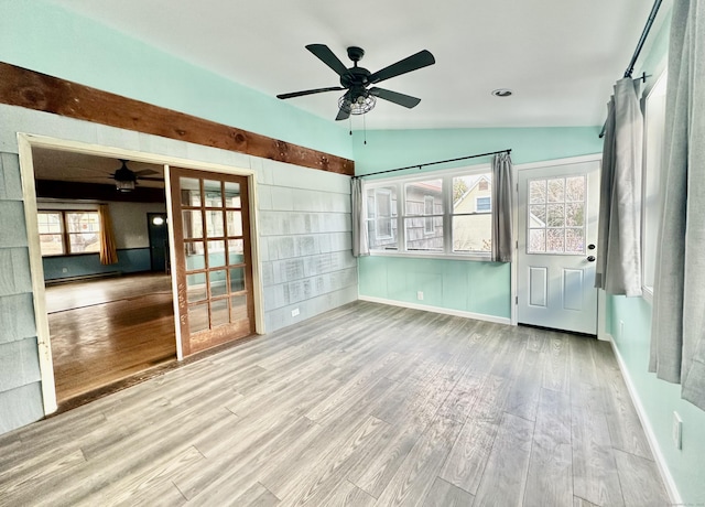 unfurnished sunroom featuring vaulted ceiling and ceiling fan