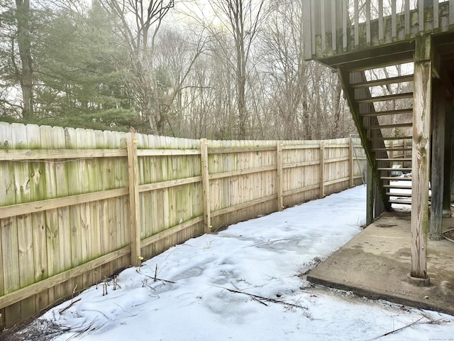 view of yard layered in snow