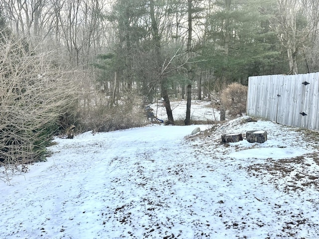 view of yard layered in snow