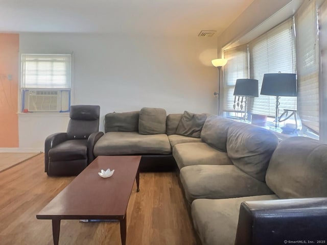 living room featuring hardwood / wood-style flooring and cooling unit