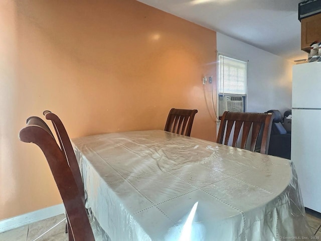 tiled dining space featuring cooling unit