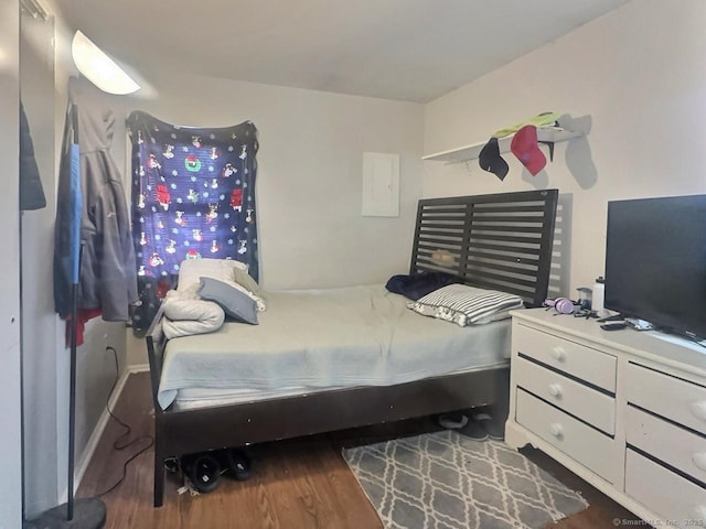 bedroom with wood-type flooring