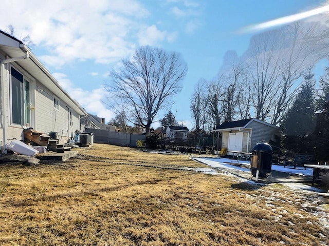 view of yard with a shed and a patio