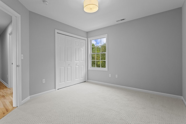 bedroom featuring carpet and a closet