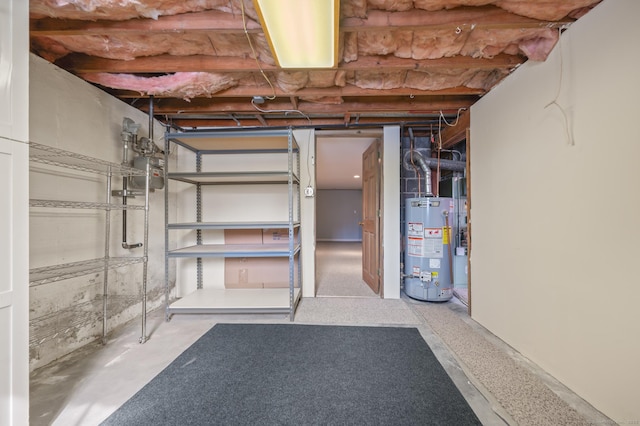 unfinished basement featuring water heater