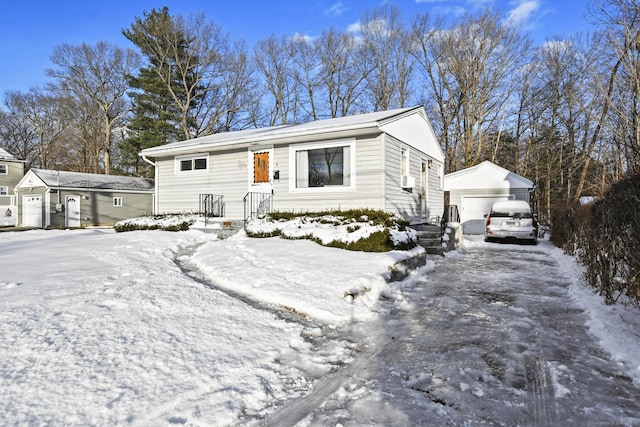 view of front of property featuring an outbuilding and a detached garage