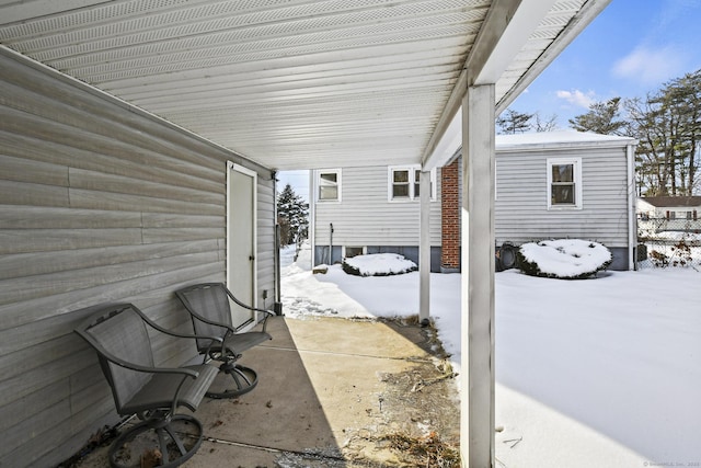 view of snow covered patio