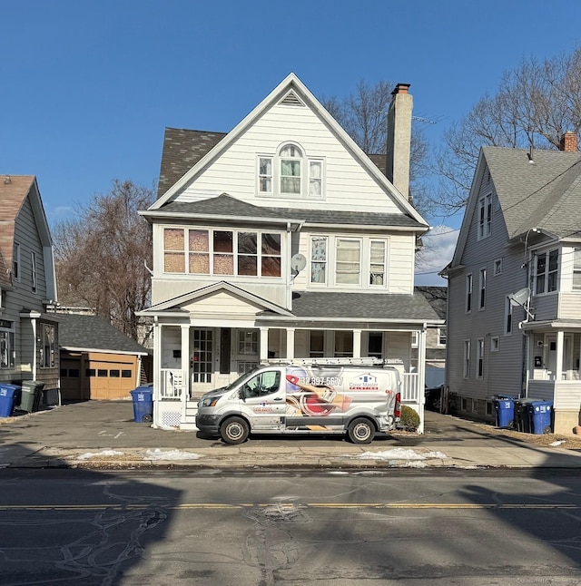 view of front of house with an outbuilding and a garage