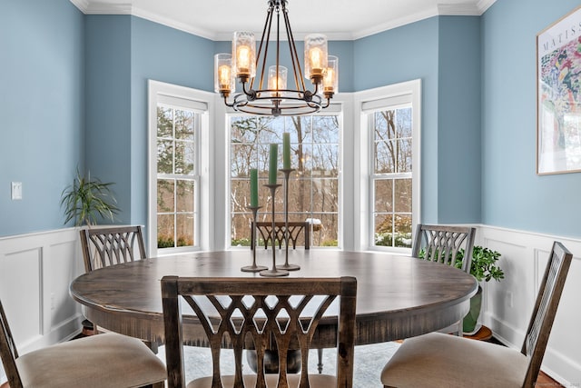 dining area with a notable chandelier and ornamental molding