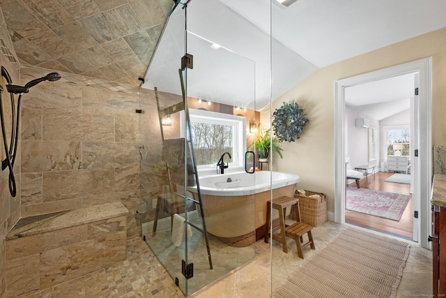 bathroom featuring vaulted ceiling and separate shower and tub