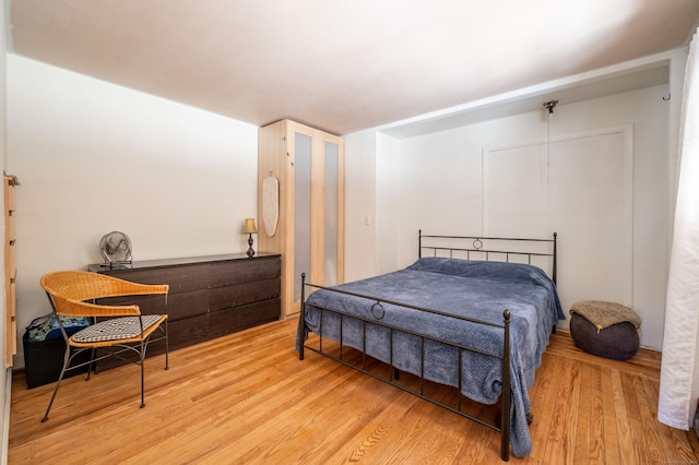 bedroom with light wood-type flooring