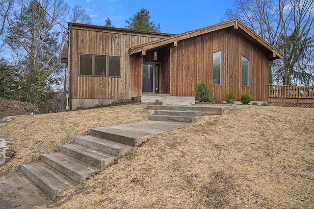 view of front facade with a wooden deck