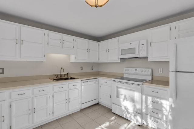 kitchen with white cabinetry, sink, white appliances, and light tile patterned floors