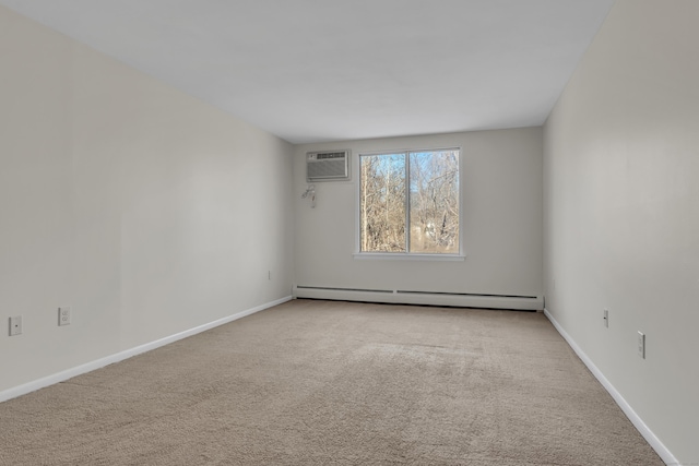 spare room featuring light colored carpet, a wall unit AC, and baseboard heating