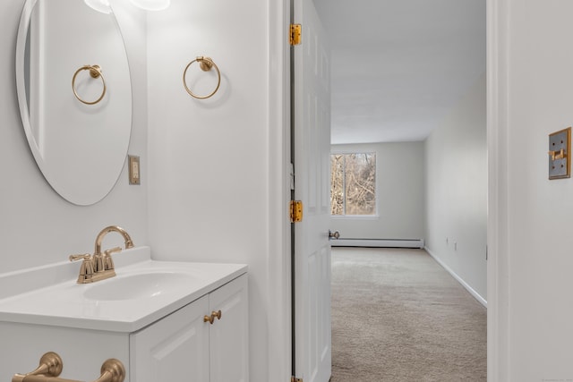 bathroom with vanity and a baseboard radiator