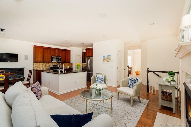 living room with light hardwood / wood-style floors