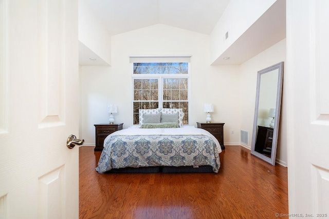 bedroom featuring vaulted ceiling and hardwood / wood-style floors