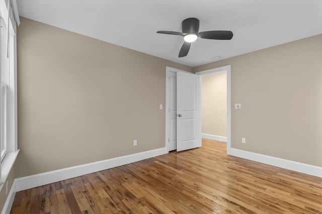 unfurnished bedroom featuring light hardwood / wood-style flooring and ceiling fan