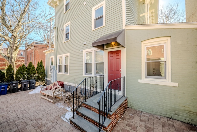 entrance to property with a patio area