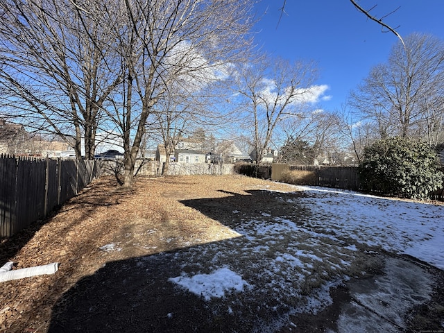 view of yard covered in snow