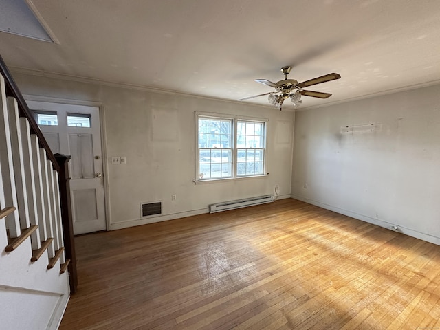 foyer featuring a baseboard radiator, ornamental molding, hardwood / wood-style floors, and ceiling fan