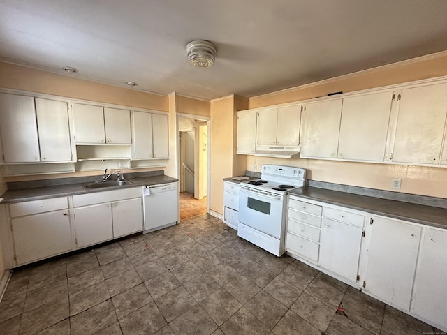 kitchen with sink, white appliances, ornamental molding, and white cabinets