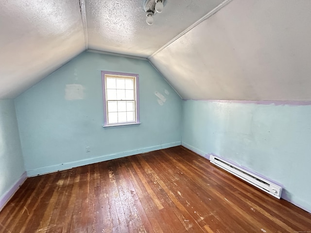 bonus room featuring dark hardwood / wood-style flooring, lofted ceiling, a textured ceiling, and baseboard heating