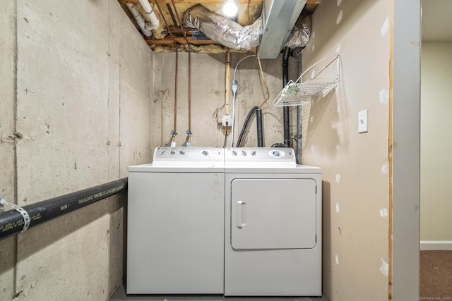 laundry room with washing machine and clothes dryer