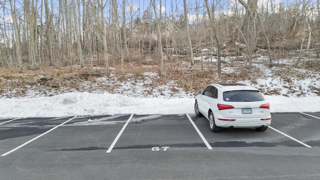 view of snow covered parking