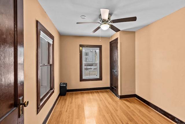 unfurnished room with ceiling fan and light hardwood / wood-style floors