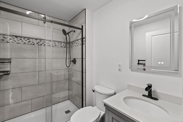 bathroom with vanity, toilet, and walk in shower