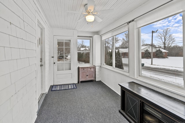 sunroom featuring plenty of natural light and ceiling fan