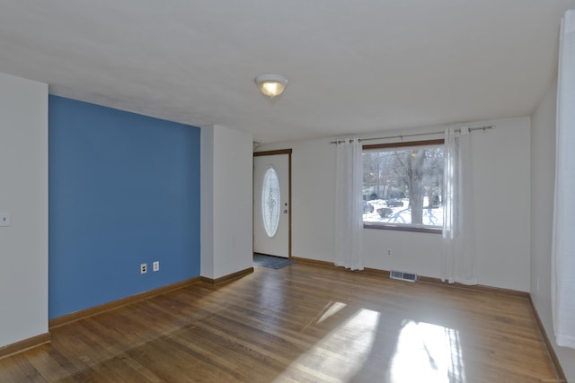 entryway with hardwood / wood-style flooring