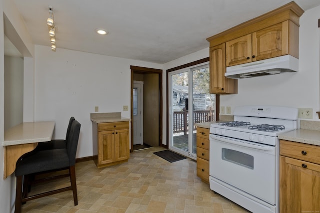 kitchen featuring white range with gas stovetop