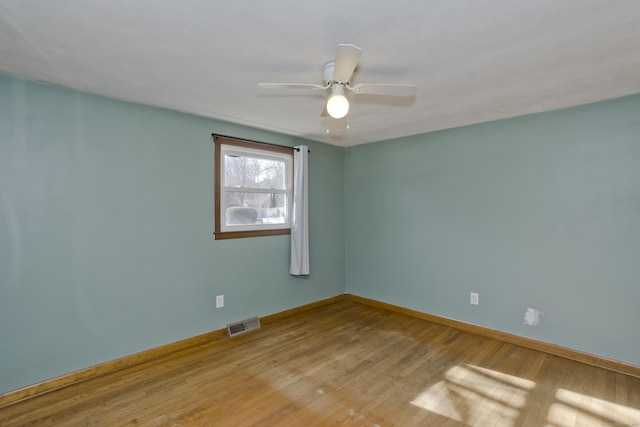 unfurnished room with ceiling fan and light hardwood / wood-style floors