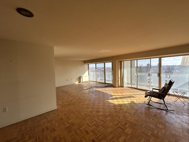 interior space featuring a water view and parquet floors