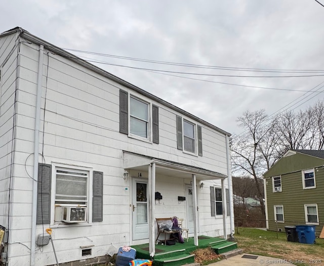 view of front of house featuring cooling unit