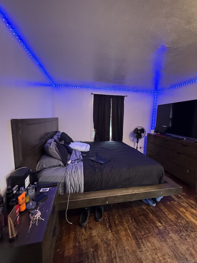 bedroom with wood-type flooring