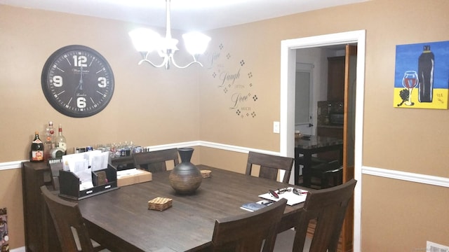 dining space featuring a chandelier