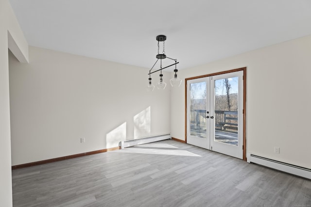 unfurnished dining area with light hardwood / wood-style flooring, a baseboard radiator, and french doors