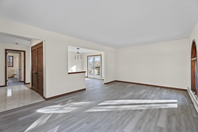 interior space with french doors and hardwood / wood-style floors