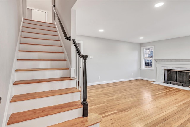 staircase featuring hardwood / wood-style floors