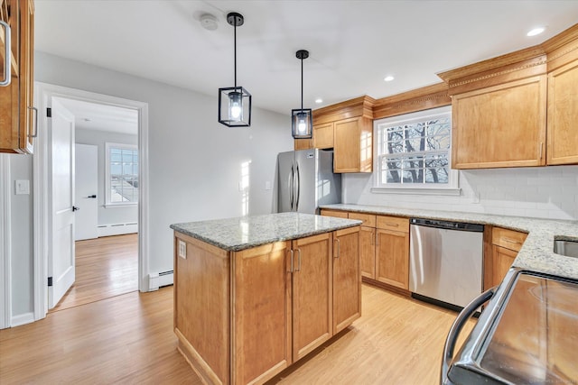 kitchen featuring pendant lighting, a baseboard heating unit, a center island, and appliances with stainless steel finishes