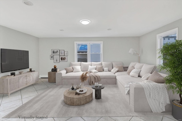 living room with a baseboard radiator and light tile patterned floors