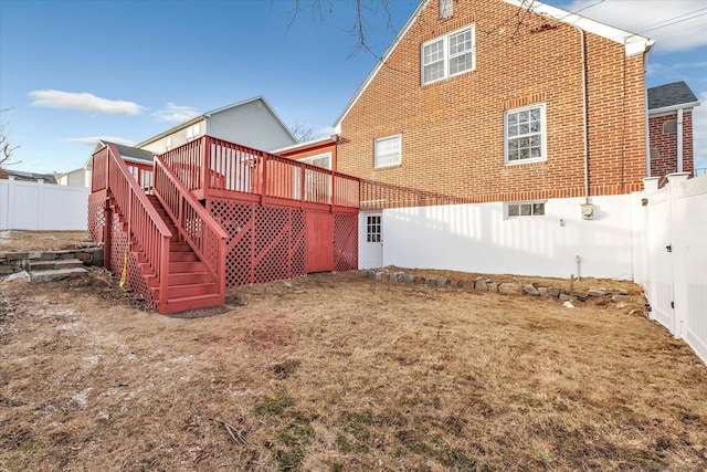 rear view of house with a wooden deck