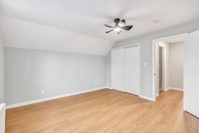 bonus room featuring lofted ceiling, ceiling fan, and light wood-type flooring