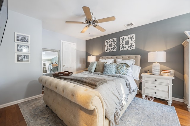 bedroom with ceiling fan and hardwood / wood-style floors